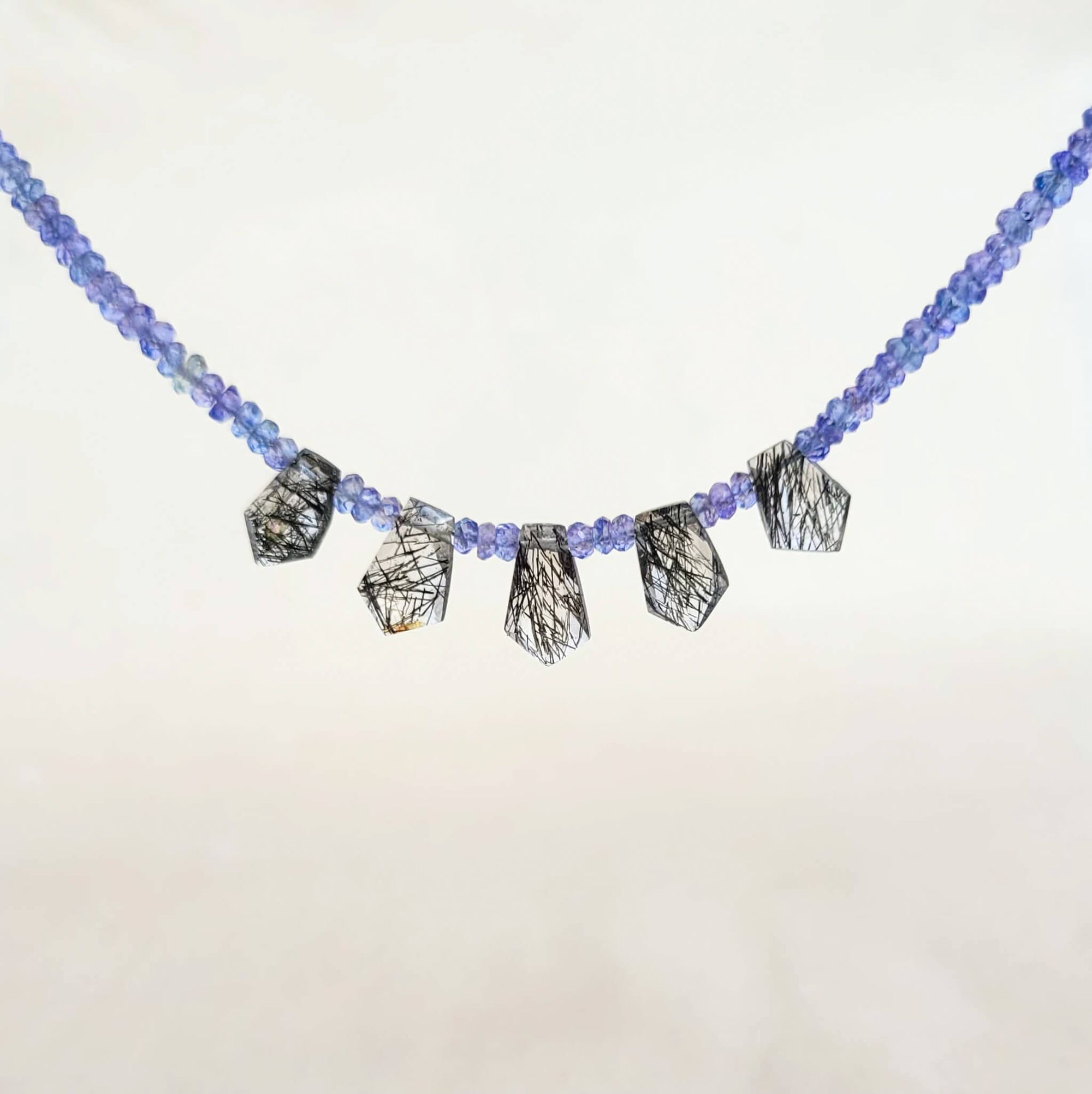 Tanzanite Faceted Bead Strand with Tourmalated Quartz Daggers
