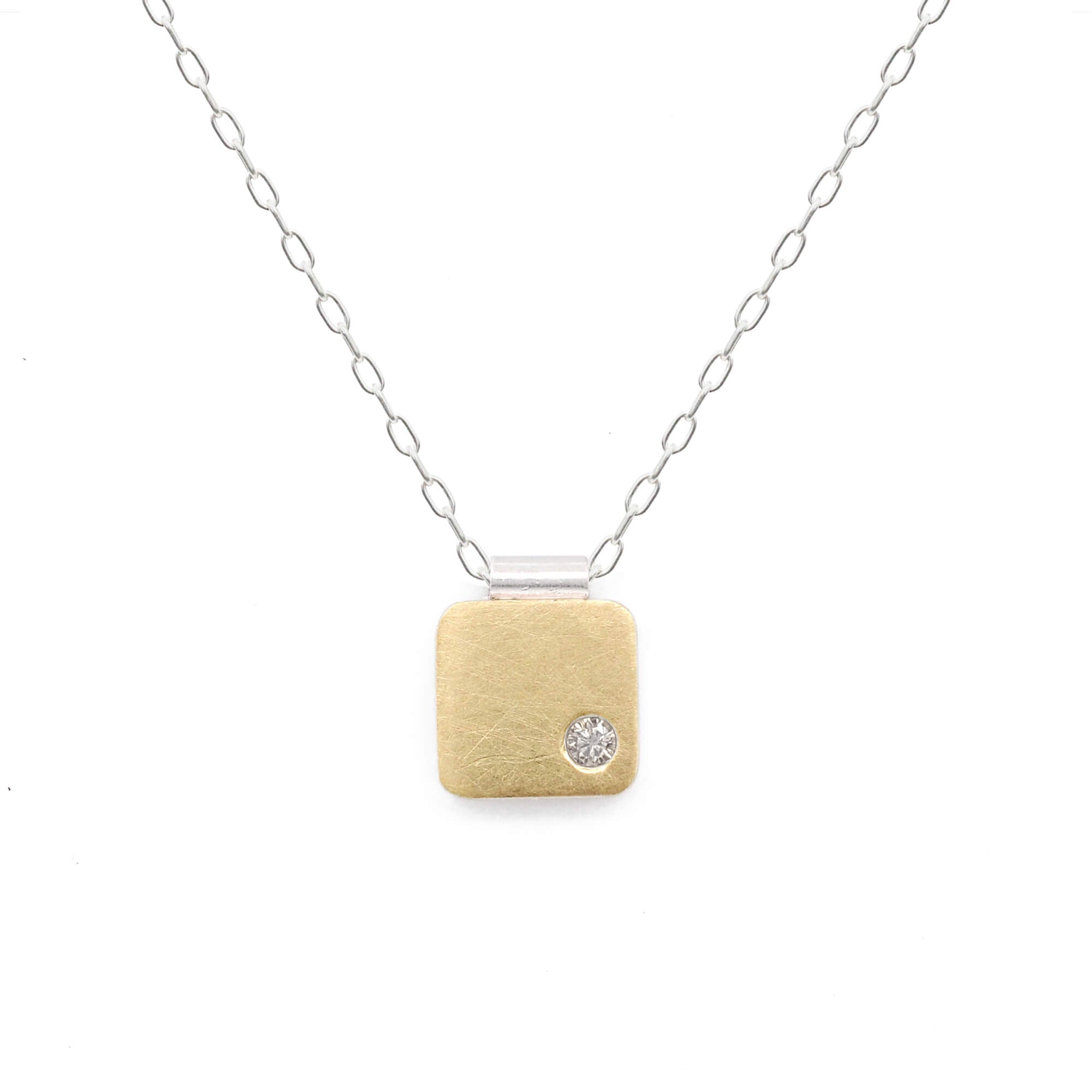 18k yellow gold cell pendant with champagne diamond. Handmade by EC Design in Minneapolis, MN using recycled metal and conflict-free stone.