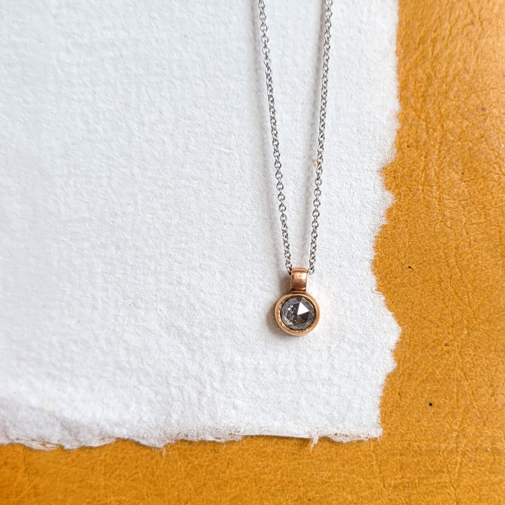 Salt and pepper diamond pendant in rose gold. Handmade by EC Design Jewelry in Minneapolis, MN using recycled metal and conflict-free stone.