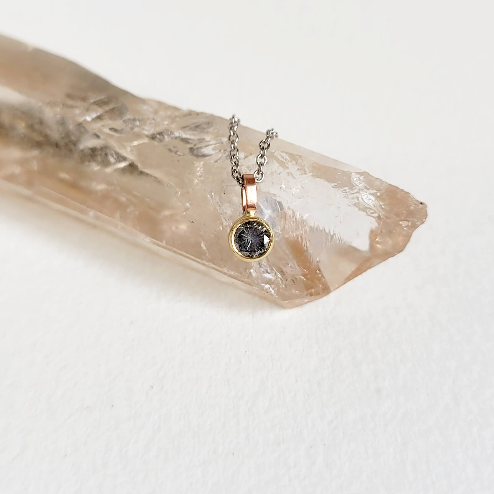 A Delicate Salt and Pepper Diamond Pendant in Mixed Golds