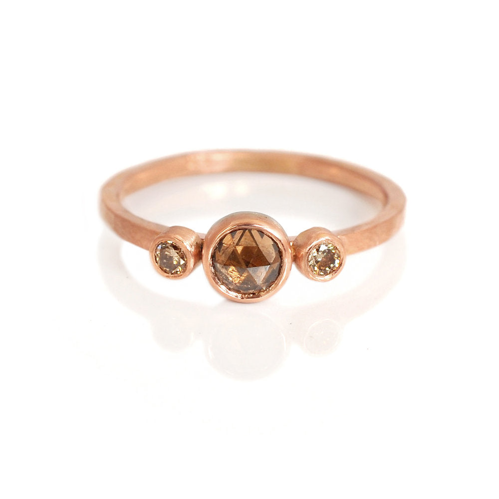 Three stone red gold ring with rose cut and brilliant cut champagne diamonds. Handmade by EC Design in Minneapolis, MN using recycled metal and conflict-free stones.