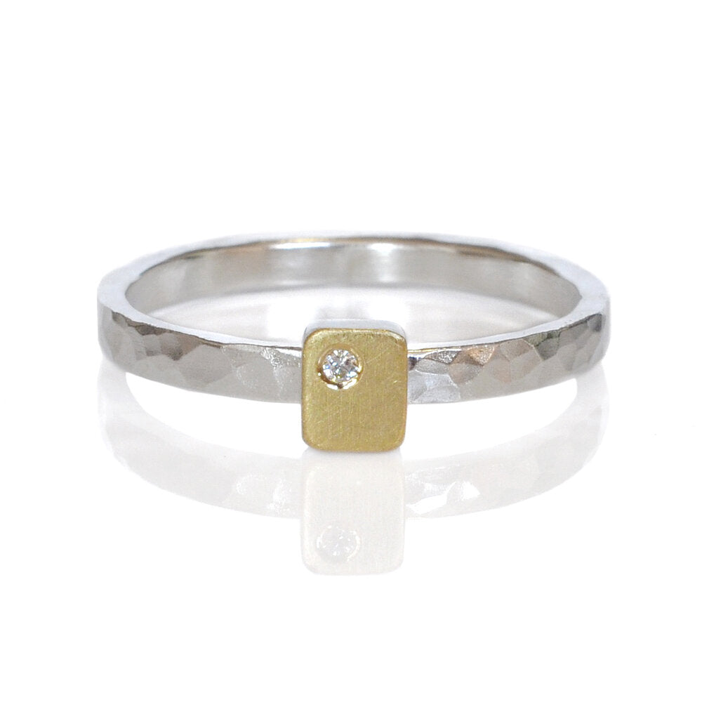 Hammered sterling silver band with a yellow gold rectangle with a flush set white diamond. Ethically created by EC Design Jewelry in Minneapolis, MN.