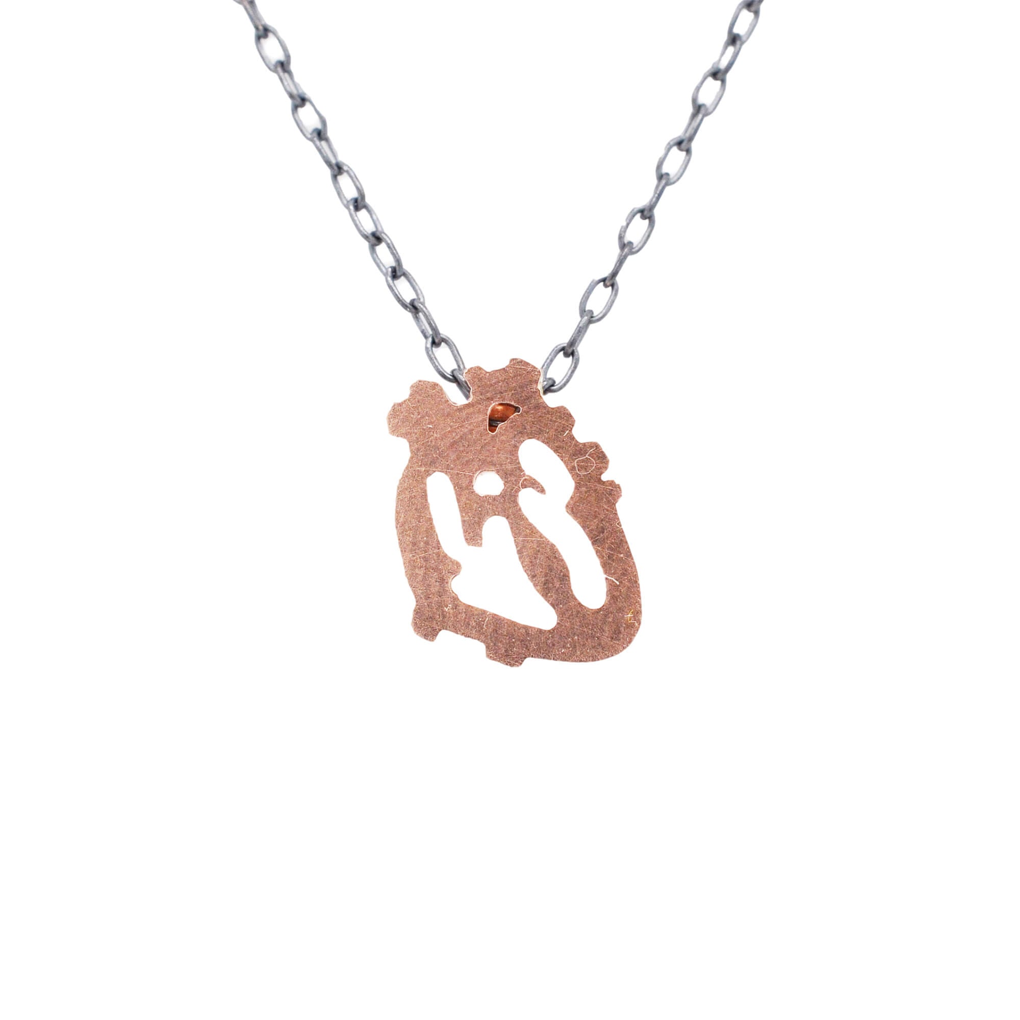 Rose gold anatomical heart on an oxidized silver chain. Handmade by EC Design Studio in Minneapolis, MN using recycled metal.